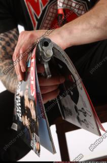 Alex Sitting With Pistol Pose 10